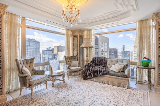 living area featuring a view of city, a tray ceiling, a wealth of natural light, and an inviting chandelier