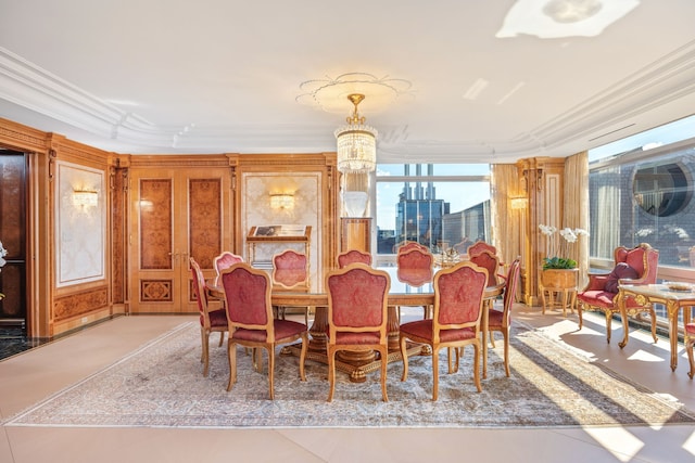 dining room with a notable chandelier and crown molding