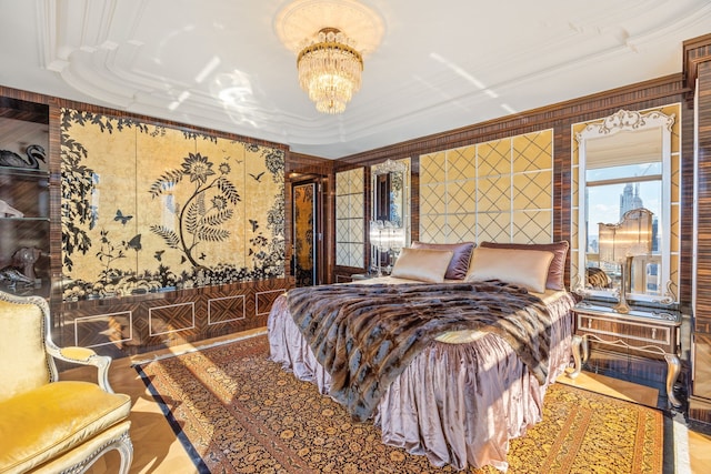 bedroom featuring ornamental molding and an inviting chandelier