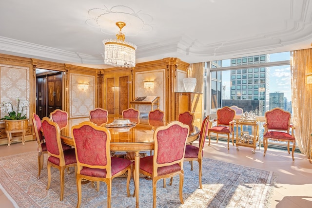 dining room with an inviting chandelier, expansive windows, and crown molding