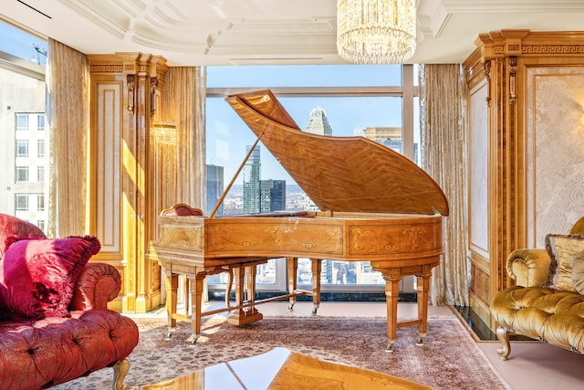 living area featuring crown molding, a view of city, and a notable chandelier