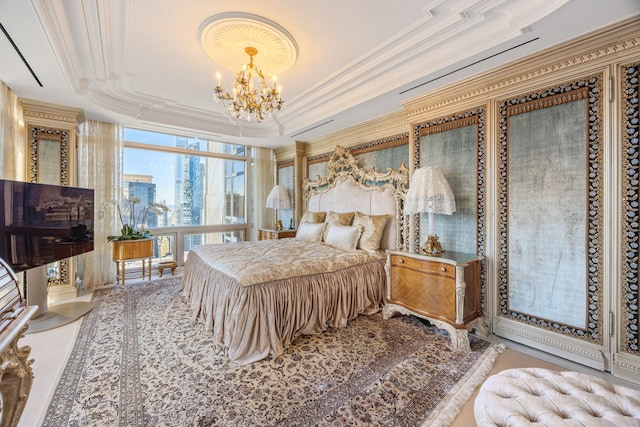 bedroom with crown molding, a tray ceiling, floor to ceiling windows, and a notable chandelier