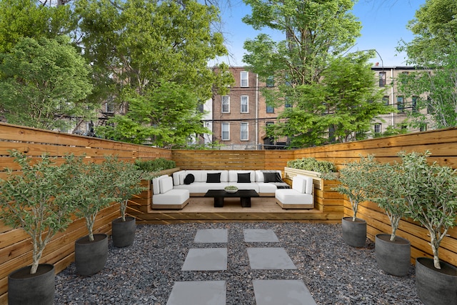 view of patio / terrace with outdoor lounge area and fence