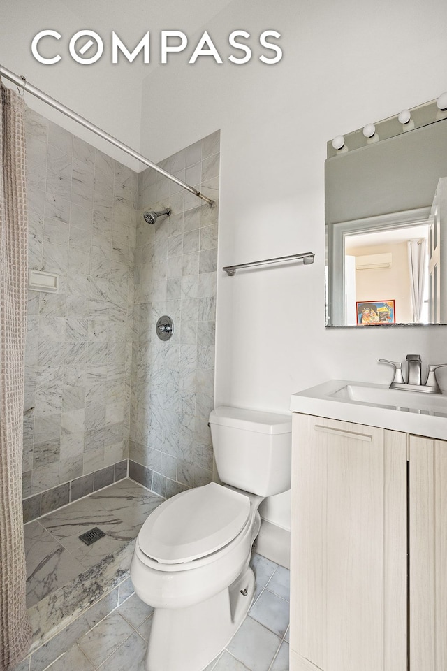 full bathroom featuring vanity, toilet, marble finish floor, and tiled shower