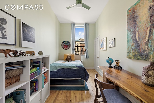 bedroom with baseboards, wood finished floors, and a ceiling fan