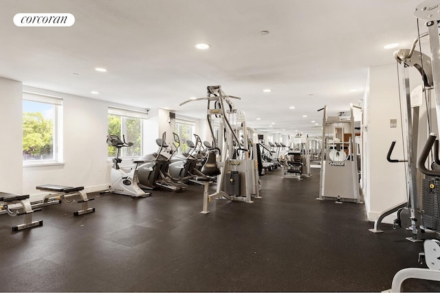 workout area with baseboards, visible vents, and recessed lighting