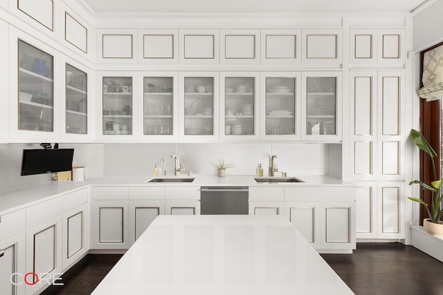 bar featuring dishwasher, a sink, and dark wood-style floors