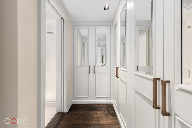 corridor with dark wood finished floors