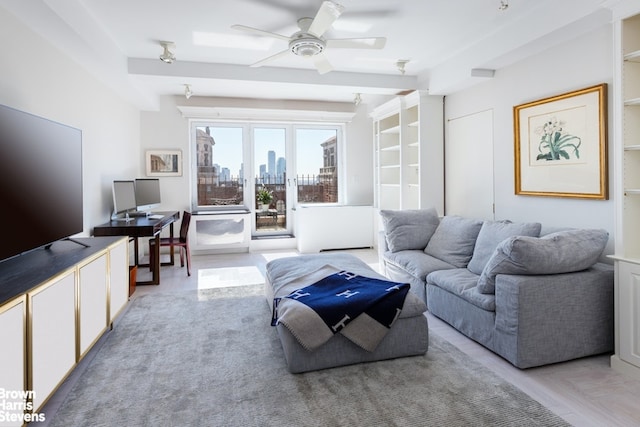 living room featuring a ceiling fan