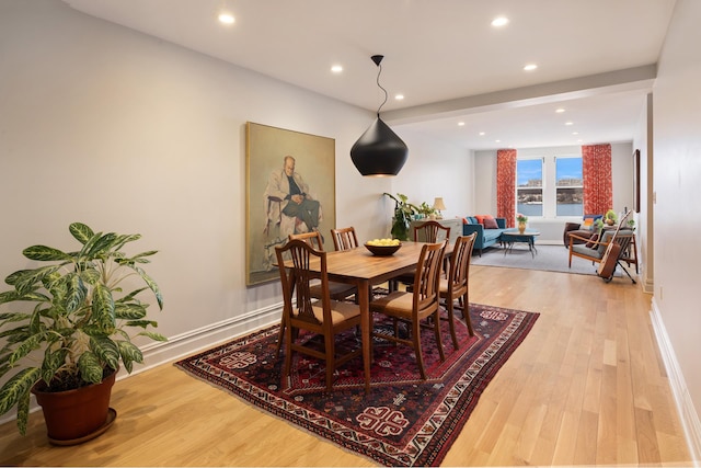 dining area with light wood-type flooring, baseboards, and recessed lighting