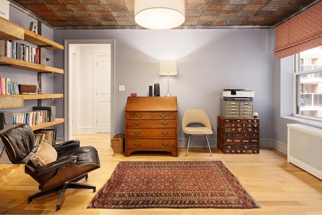 156-08 Riverside Dr W Unit 3H, New York City, NY 10032 - living area featuring radiator, an ornate ceiling, wood finished floors, and baseboards