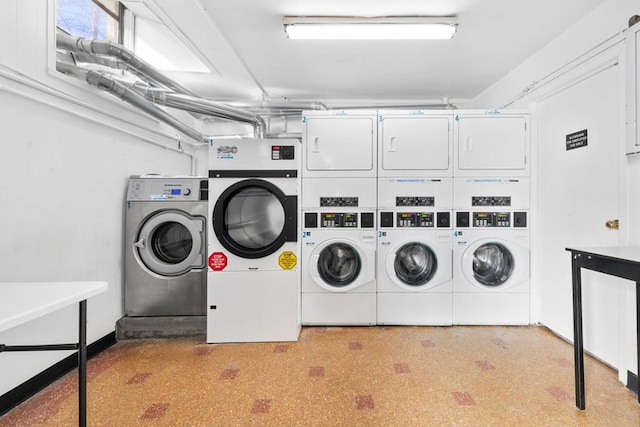 common laundry area with washer and dryer and stacked washing maching and dryer