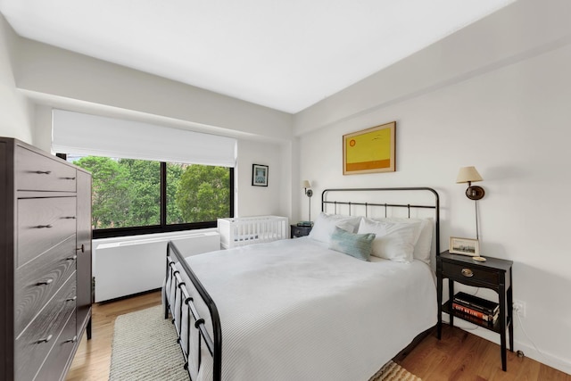 bedroom featuring wood finished floors