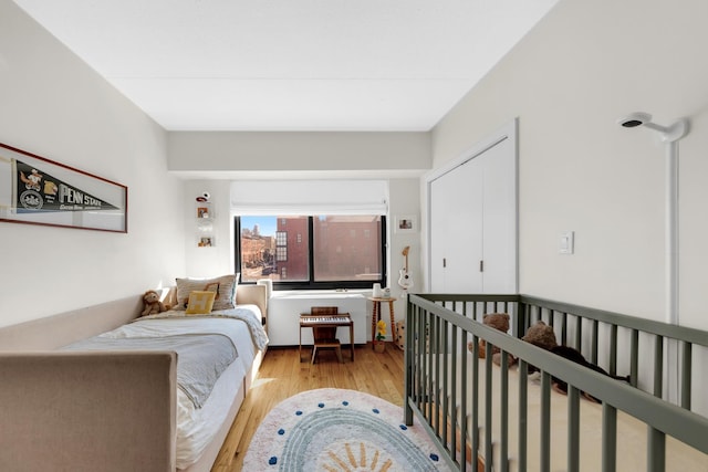 bedroom with wood finished floors