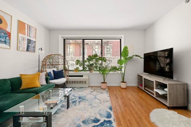 5 W 127th St Unit 2-A, New York City, NY 10027 - living area with wood finished floors, baseboards, and radiator heating unit