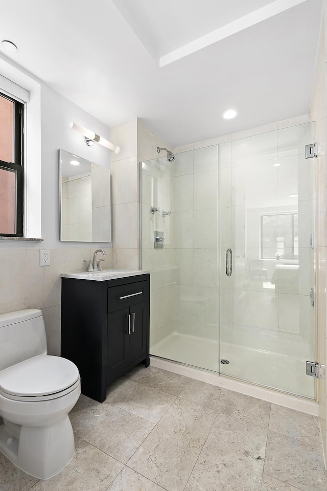 5 W 127th St Unit 2-A, New York City, NY 10027 - full bathroom featuring vanity, a shower stall, toilet, and tile walls