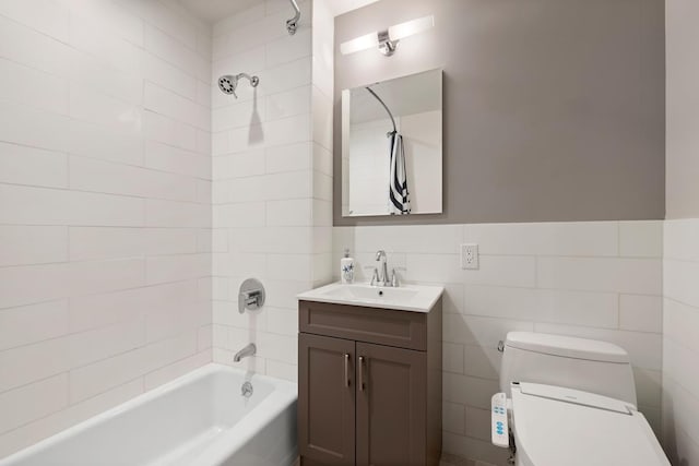 5 W 127th St Unit 2-A, New York City, NY 10027 - bathroom with vanity, toilet, tub / shower combination, tile walls, and a wainscoted wall