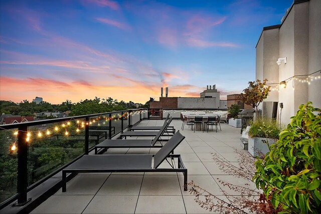 1702 Newkirk Ave Unit 5A, New York City, NY 11226 - patio terrace at dusk featuring outdoor dining space and a patio area