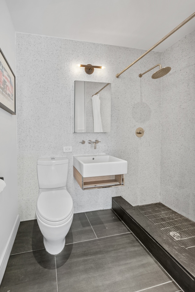 1702 Newkirk Ave Unit 5A, New York City, NY 11226 - full bath with a sink, tiled shower, and toilet