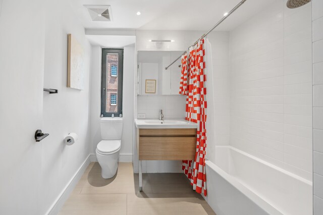 1702 Newkirk Ave Unit 5A, New York City, NY 11226 - bathroom with toilet, vanity, shower / bath combo, baseboards, and tile patterned floors