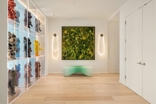 30 Front St Unit 21A/D, New York City, NY 11201 - bedroom featuring an accent wall and light wood-style flooring