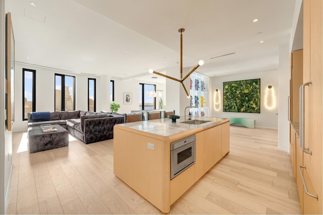 30 Front St Unit 21A/D, New York City, NY 11201 - bedroom featuring an inviting chandelier and light wood-type flooring