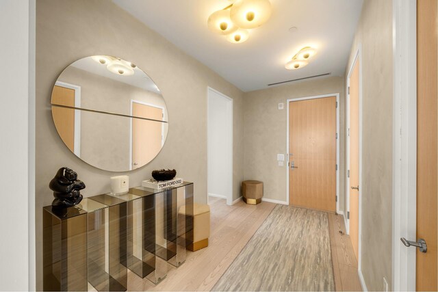 30 Front St Unit 21A/D, New York City, NY 11201 - foyer entrance featuring baseboards and light wood-style floors