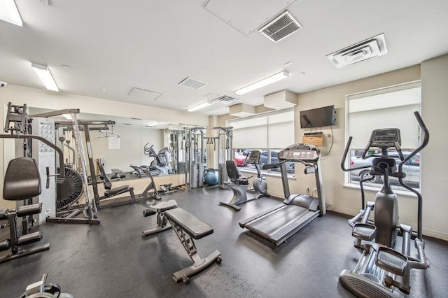 gym featuring visible vents and baseboards