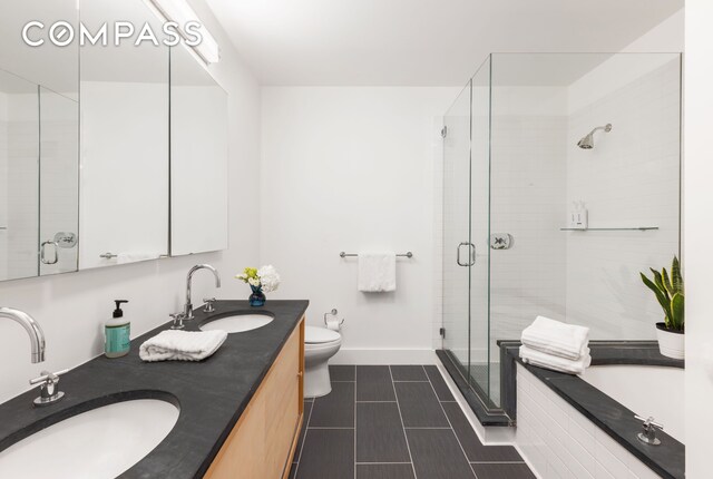 70 Washington St Unit 2K, New York City, NY 11201 - bathroom with baseboards, a sink, tile patterned flooring, and a stall shower