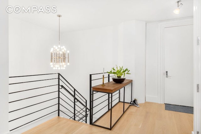 interior space with an inviting chandelier and wood finished floors