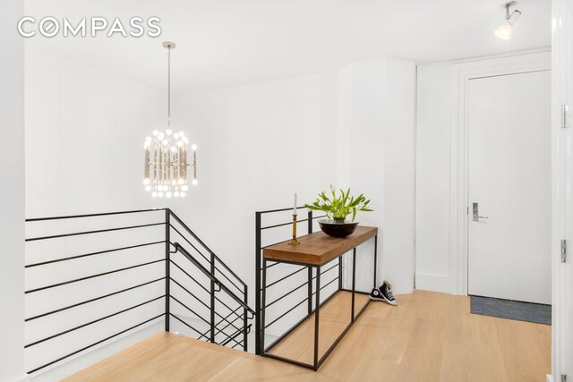 70 Washington St Unit 2K, New York City, NY 11201 - entrance foyer featuring an inviting chandelier and wood finished floors
