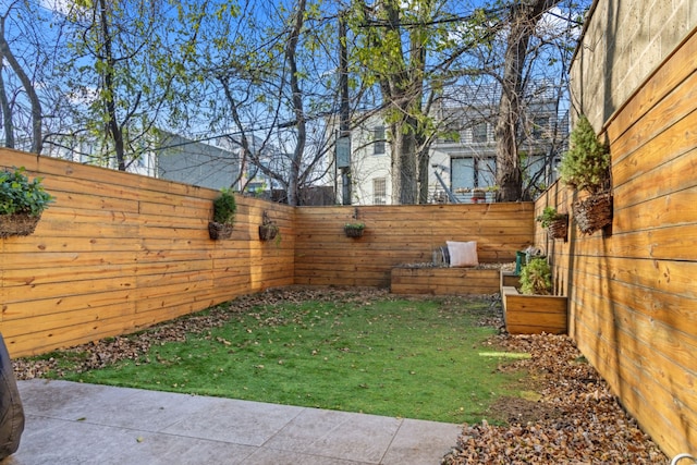 view of yard featuring a fenced backyard