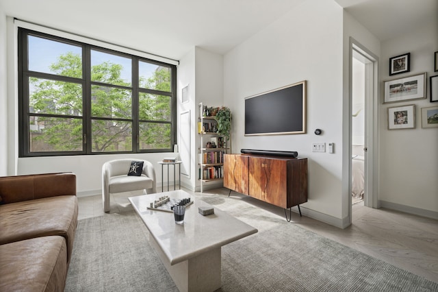 living room featuring baseboards