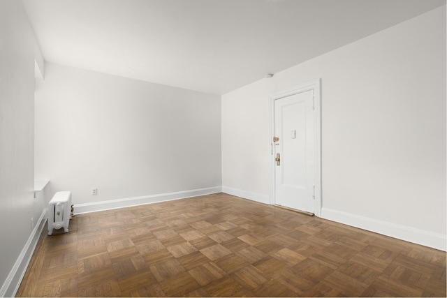 empty room featuring baseboards