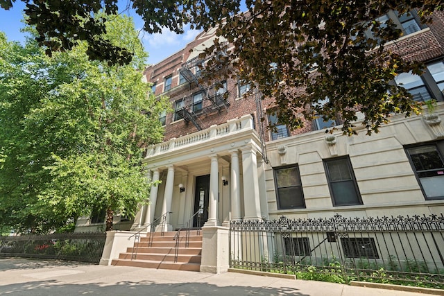 view of building exterior featuring a fenced front yard