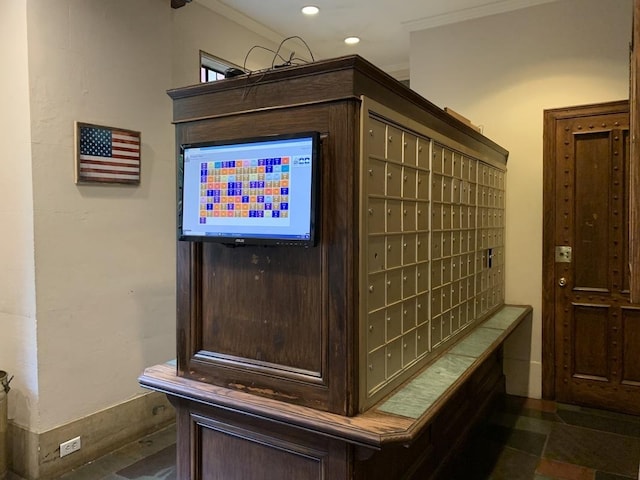 interior space with ornamental molding, recessed lighting, and mail area