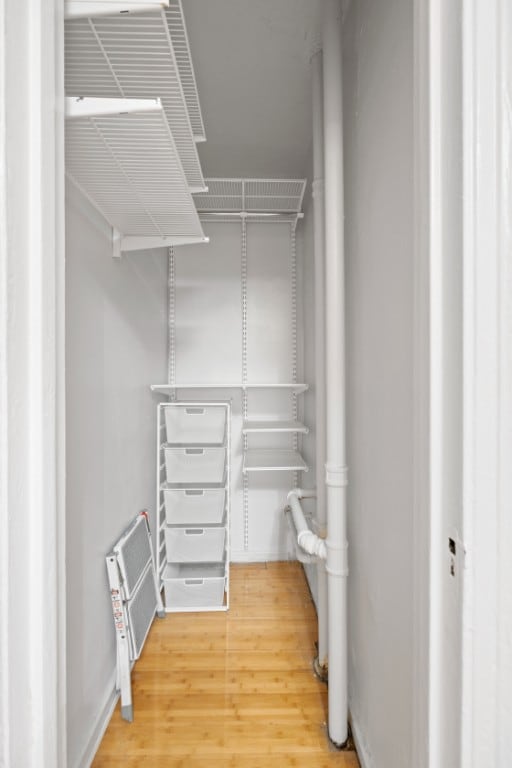 321 E 54th St Unit 2J, New York City, NY 10022 - spacious closet featuring wood finished floors