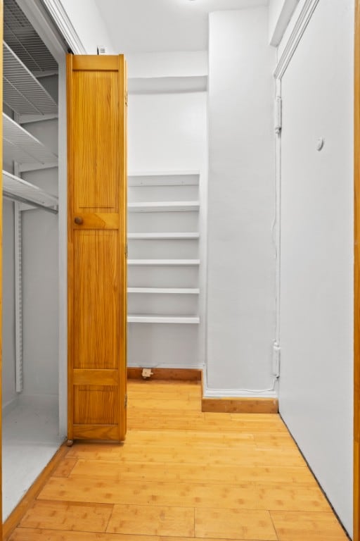 321 E 54th St Unit 2J, New York City, NY 10022 - spacious closet featuring wood-type flooring