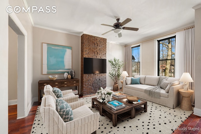 living area with ceiling fan, baseboards, wood finished floors, and ornamental molding