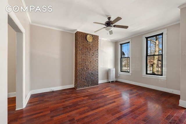 spare room with ornamental molding, hardwood / wood-style floors, radiator, baseboards, and ceiling fan