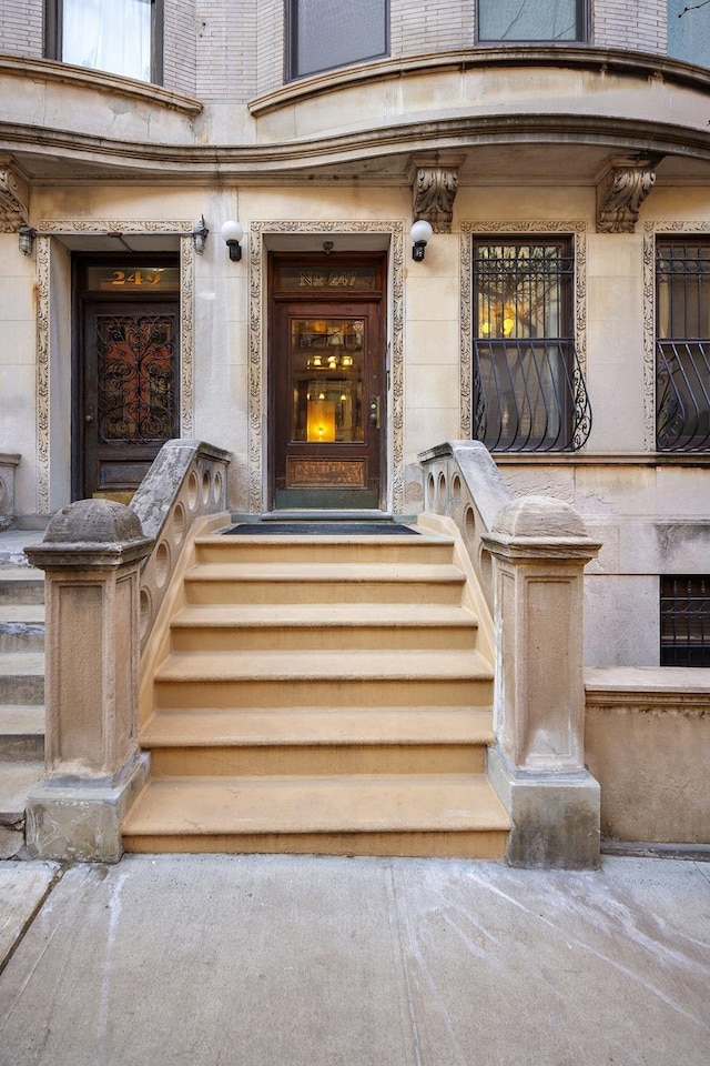 property entrance featuring stone siding