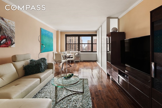 living room featuring dark wood finished floors and ornamental molding