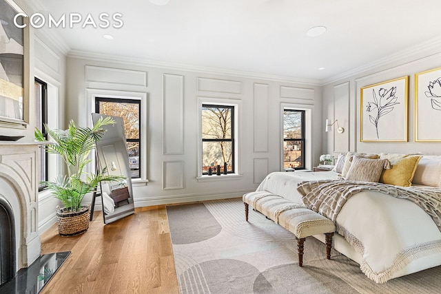 bedroom featuring a decorative wall and crown molding