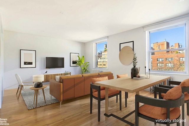 45 W 11th St Unit 8C, New York City, NY 10011 - dining area with light wood-style flooring and healthy amount of natural light