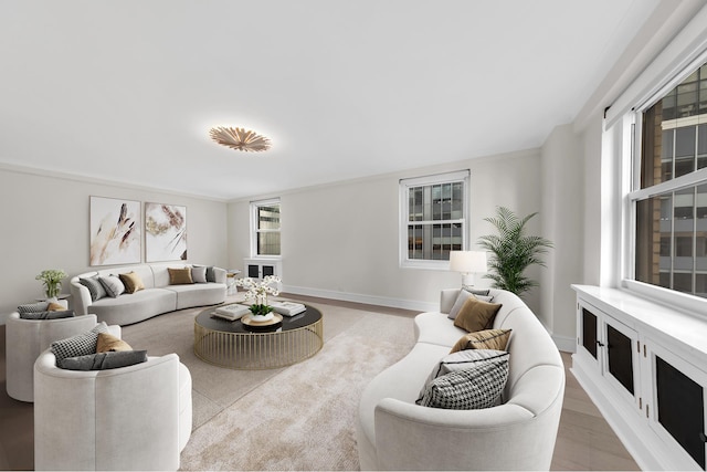 living area featuring light wood-type flooring and baseboards