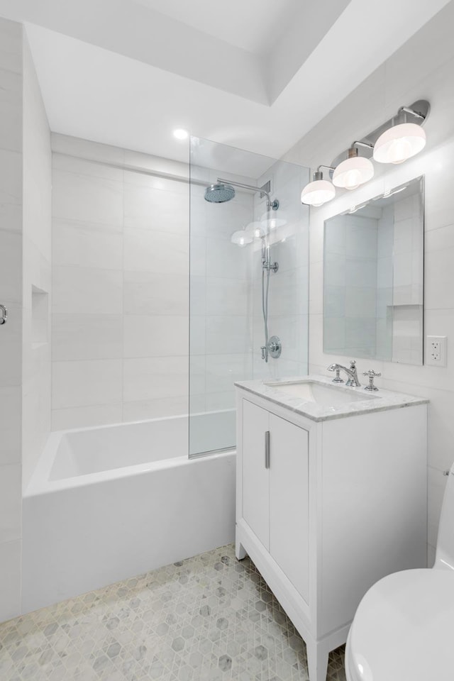 bathroom with  shower combination, vanity, and toilet