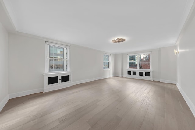 interior space with light wood-type flooring and baseboards