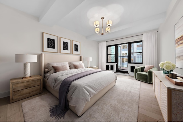 bedroom featuring access to outside, light wood finished floors, beam ceiling, and an inviting chandelier