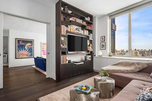 living room with dark wood-style floors and baseboards