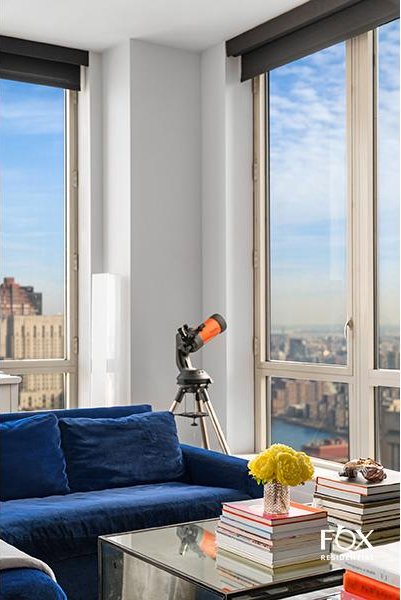 living area with floor to ceiling windows